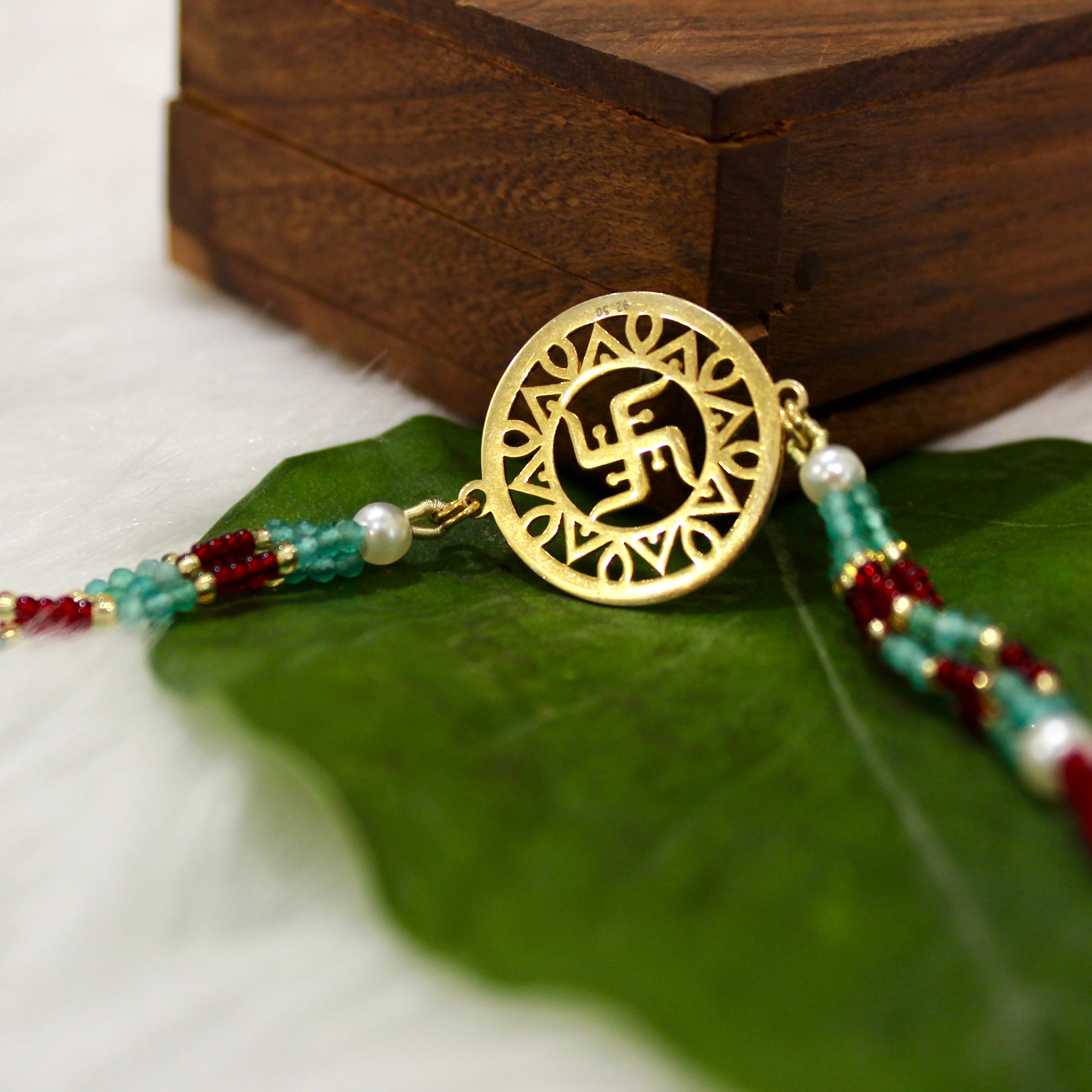 Satiya In Gold Polish Maroon Thread Rakhi In 925 Silver