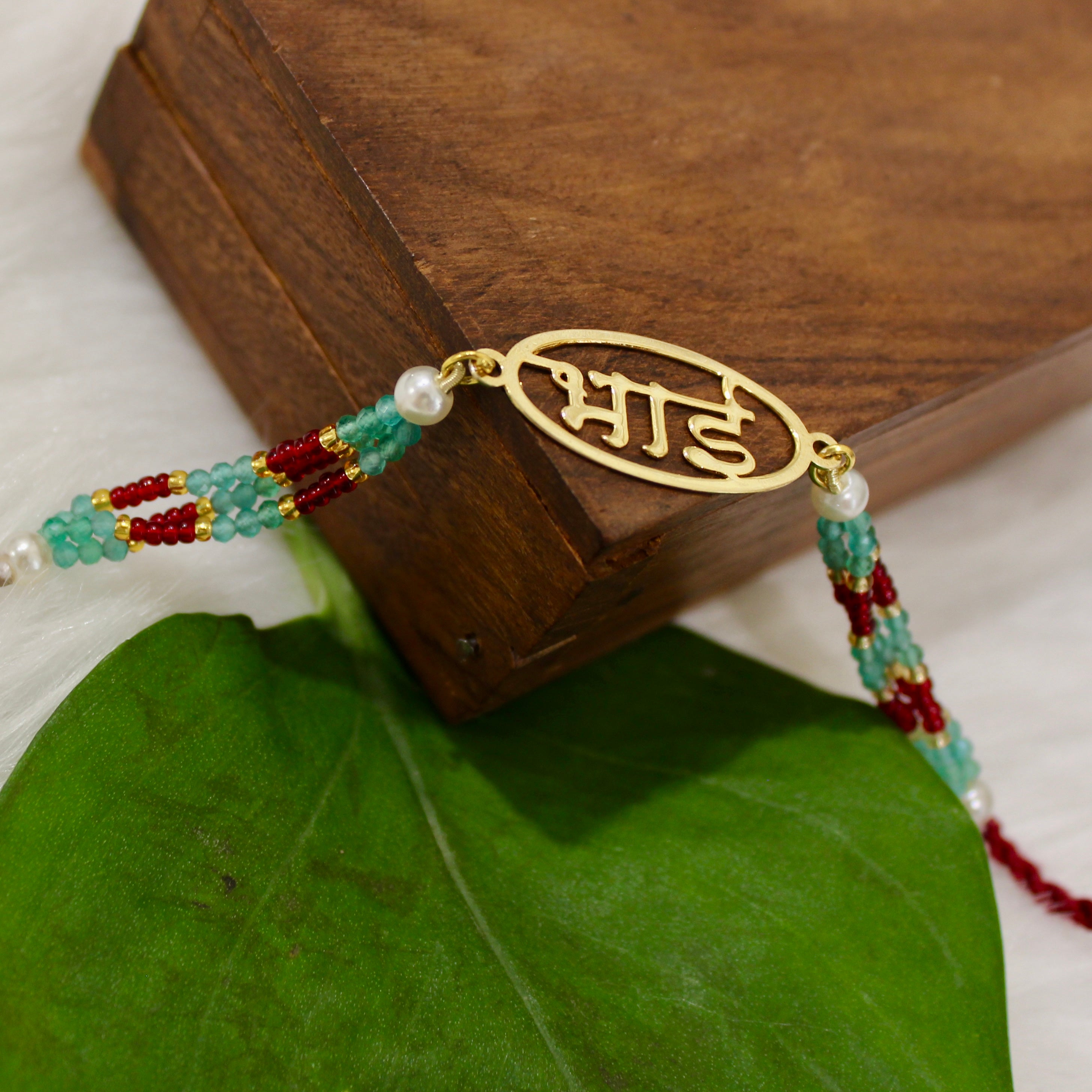 Bhai in Circle Gold Polish Maroon Thread Rakhi in 925 Silver