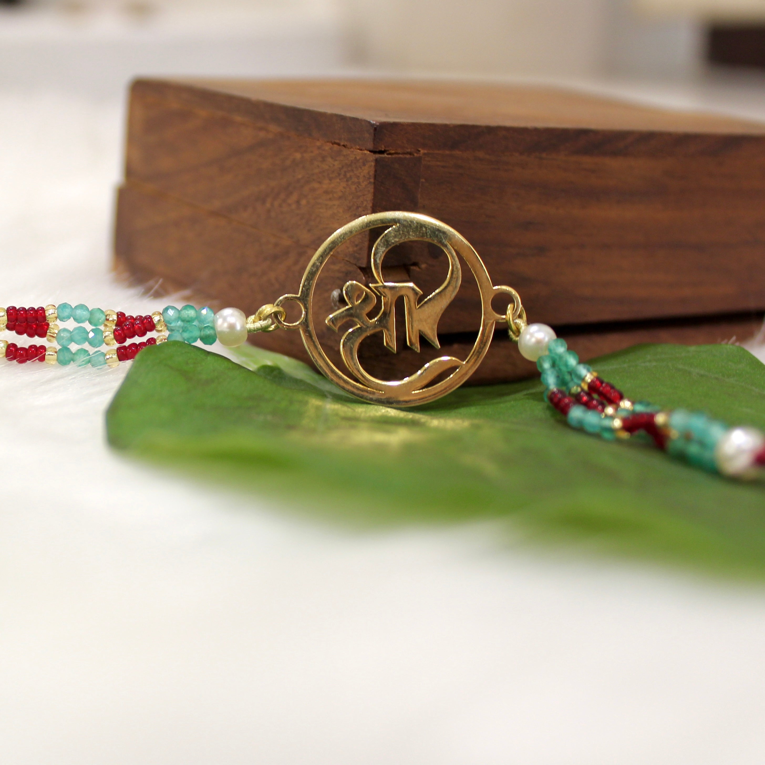 Shree In Gold Polish Maroon Thread Rakhi In 925 Silver