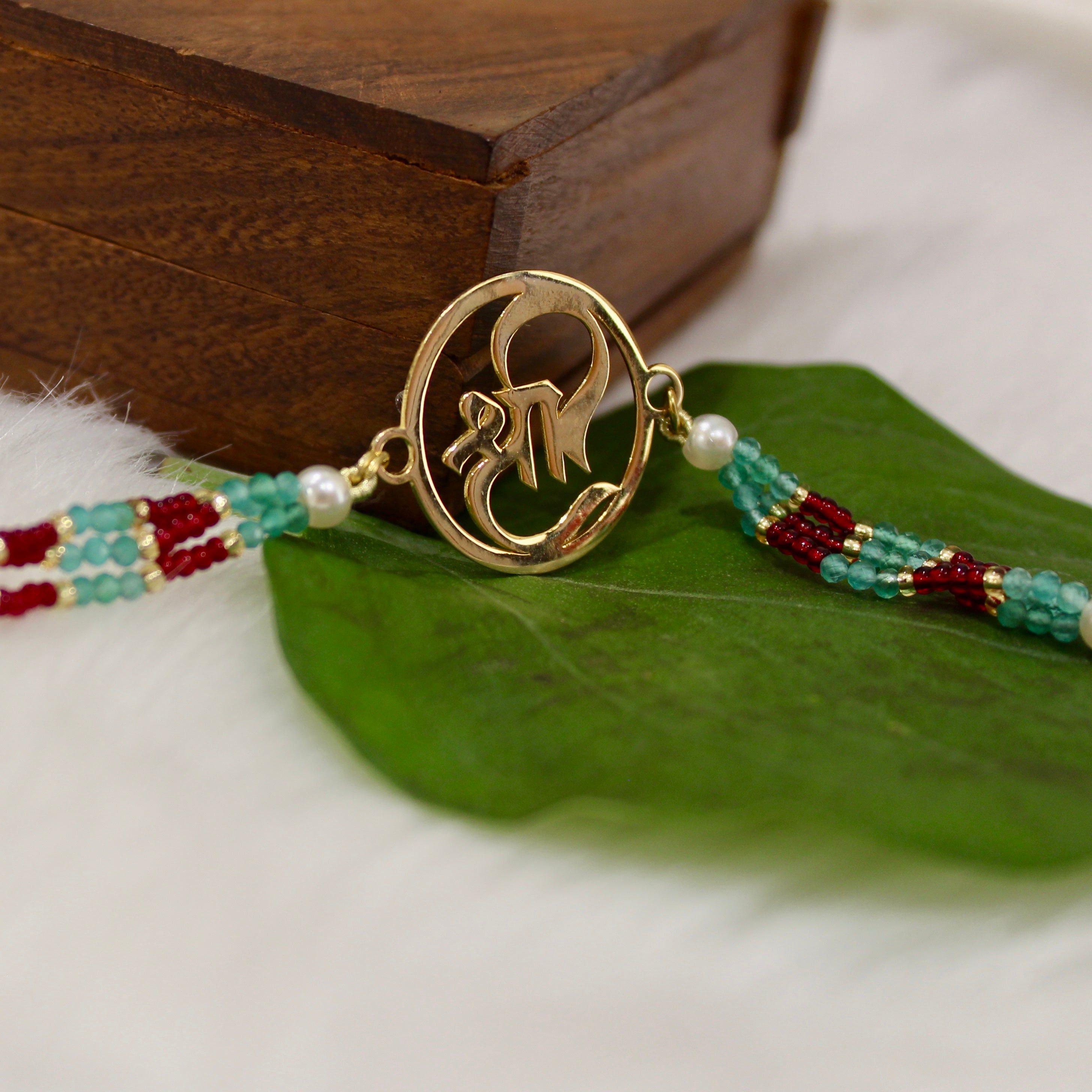 Shree In Gold Polish Maroon Thread Rakhi In 925 Silver