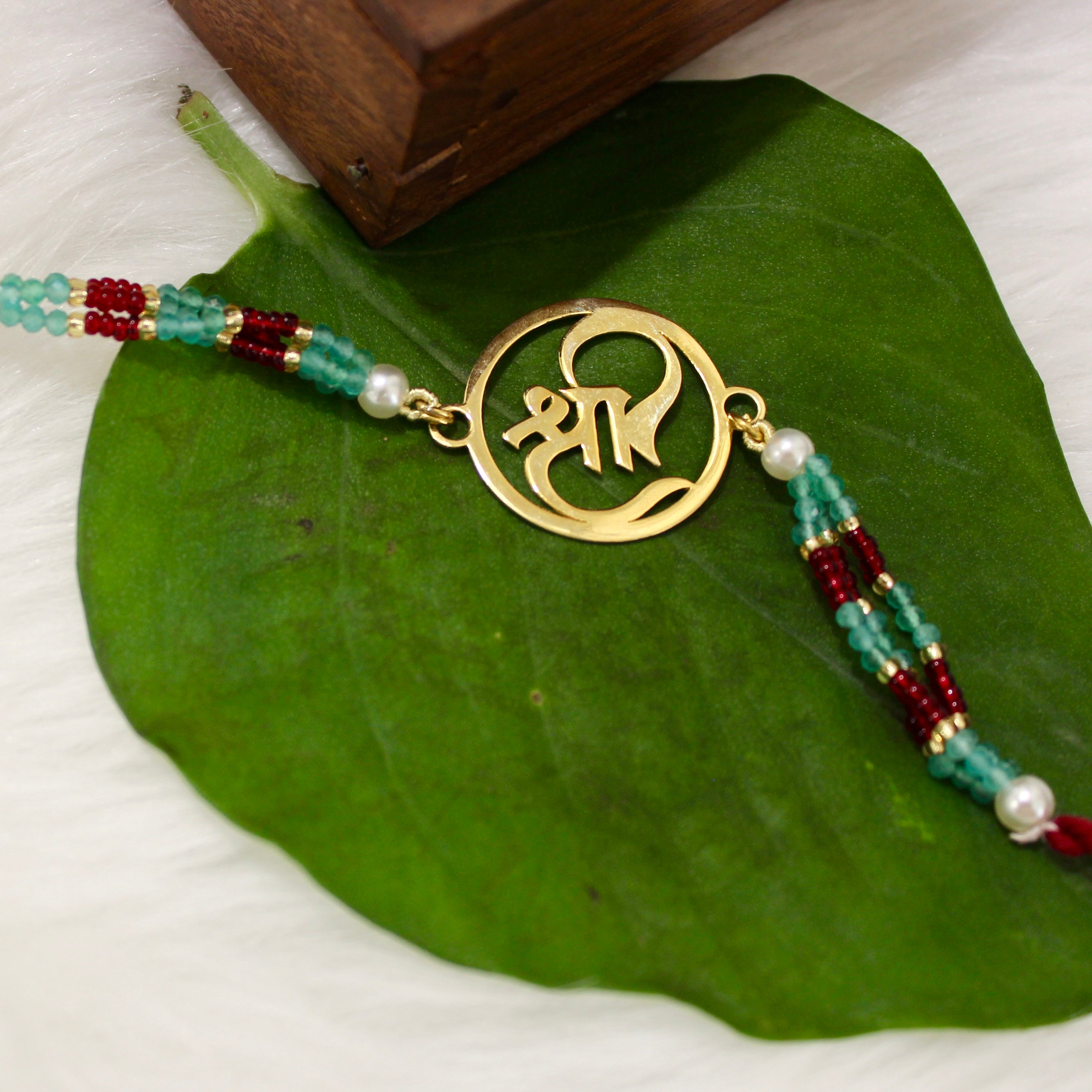 Shree In Gold Polish Maroon Thread Rakhi In 925 Silver