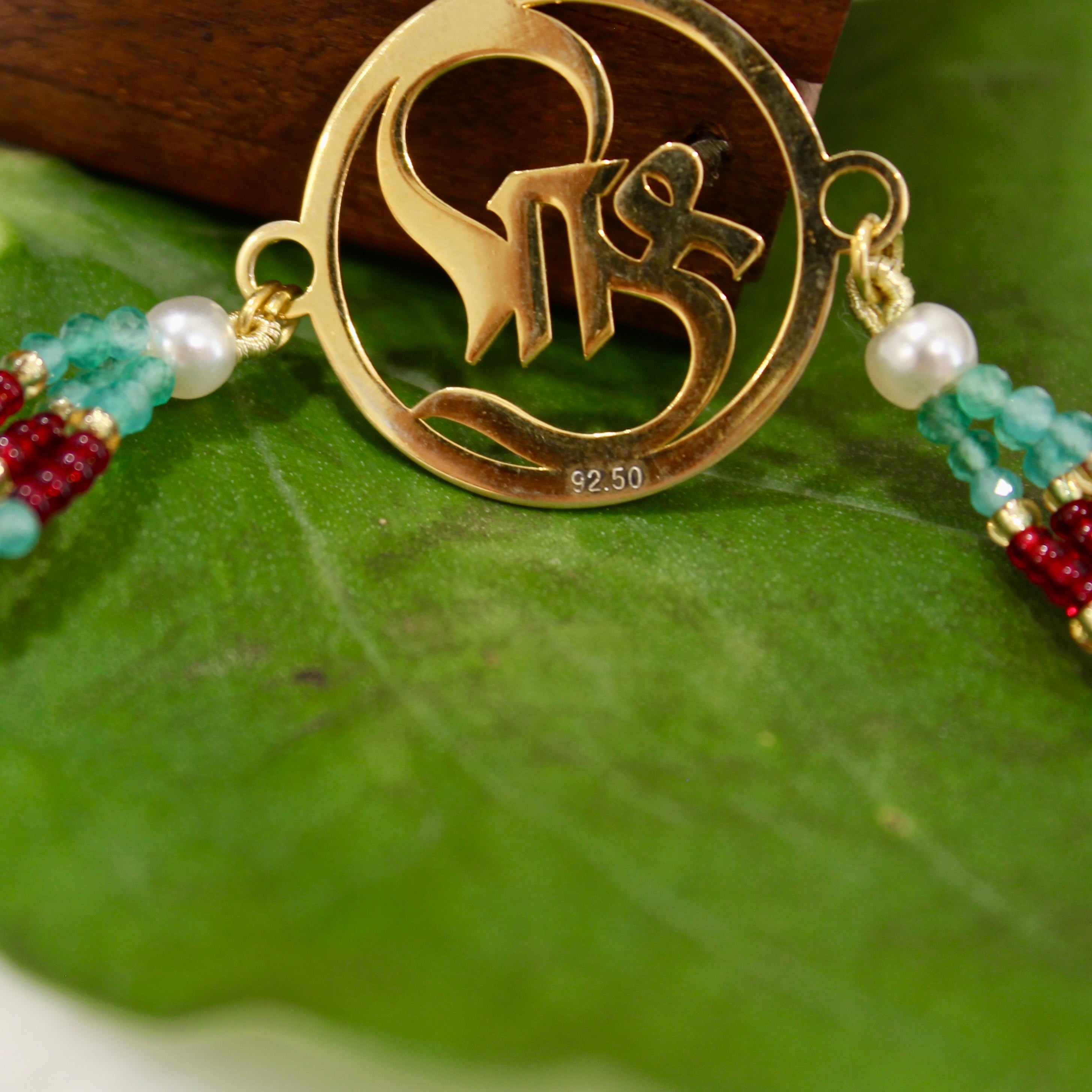 Shree In Gold Polish Maroon Thread Rakhi In 925 Silver
