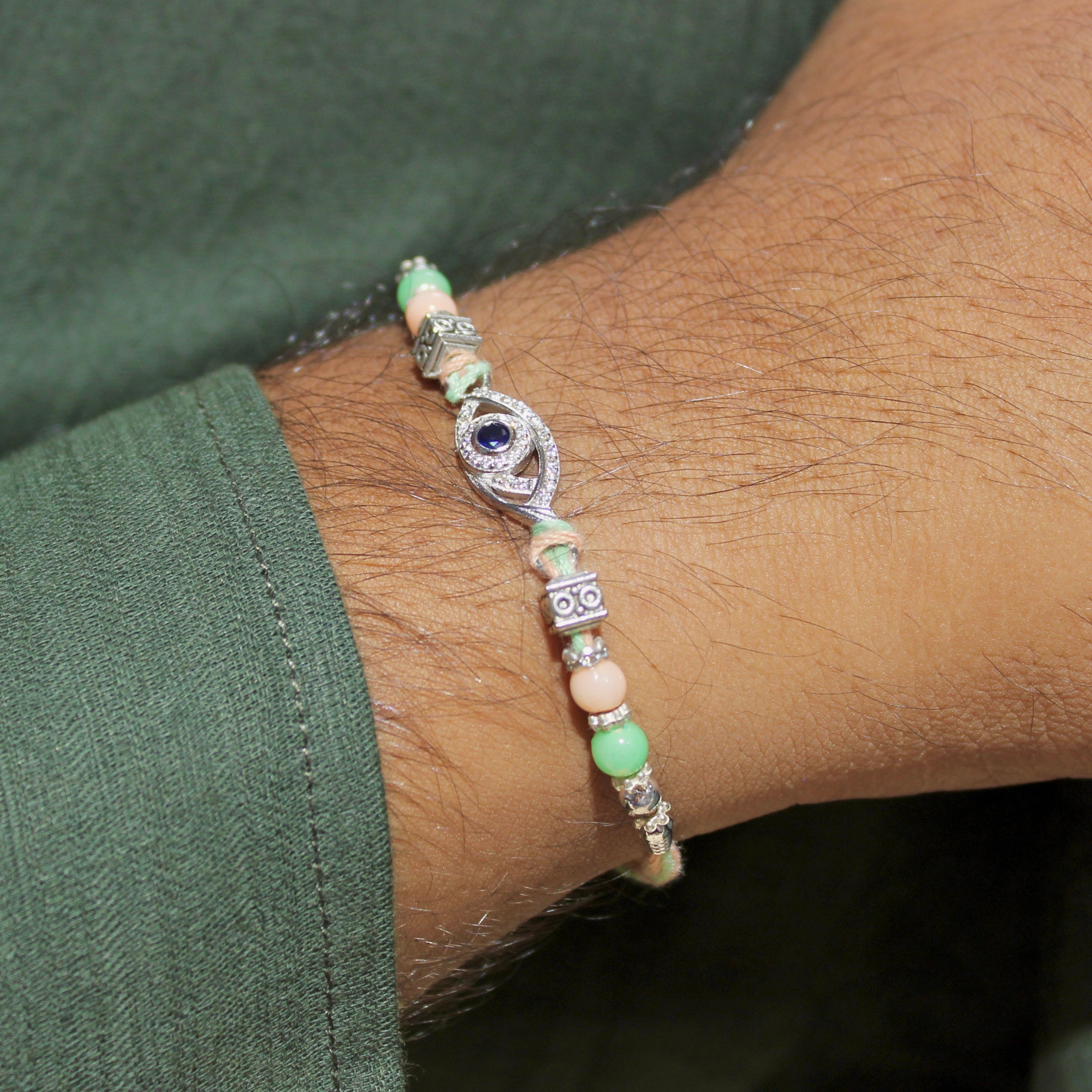 Evil Eye Charm Green Thread Rakhi In 925 Silver