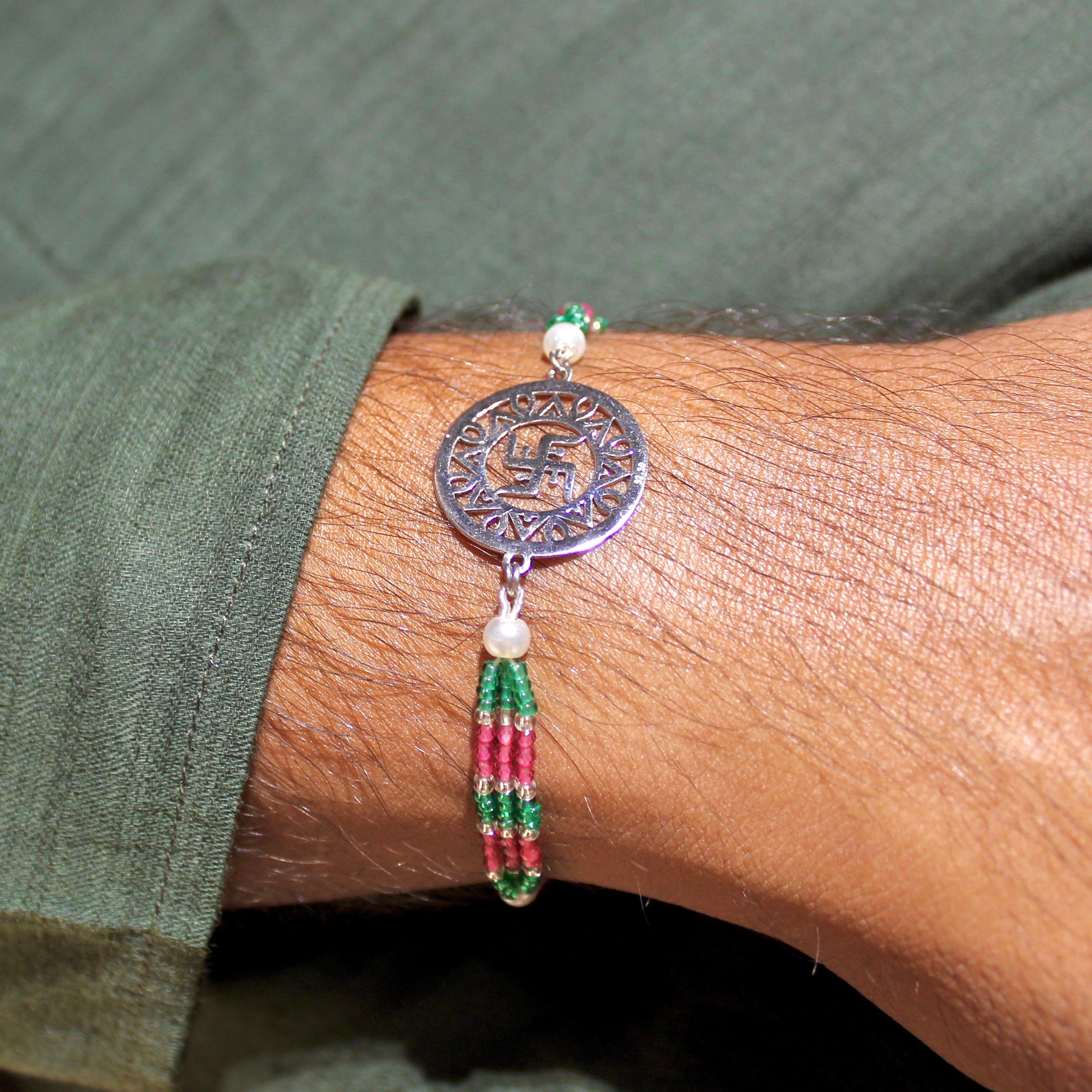 Satiya In Circle Pink Thread Rakhi In 925 Silver