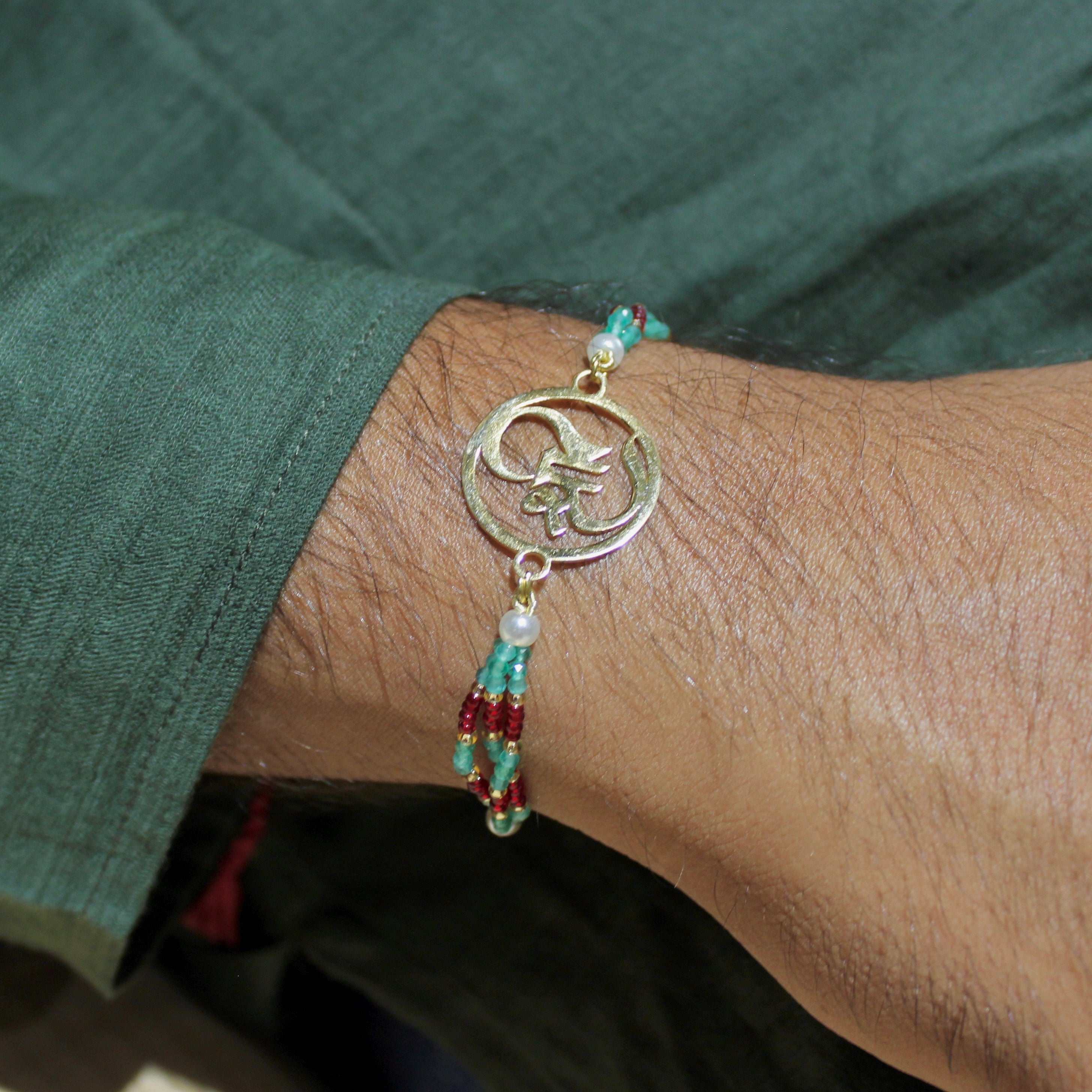 Shree In Gold Polish Maroon Thread Rakhi In 925 Silver