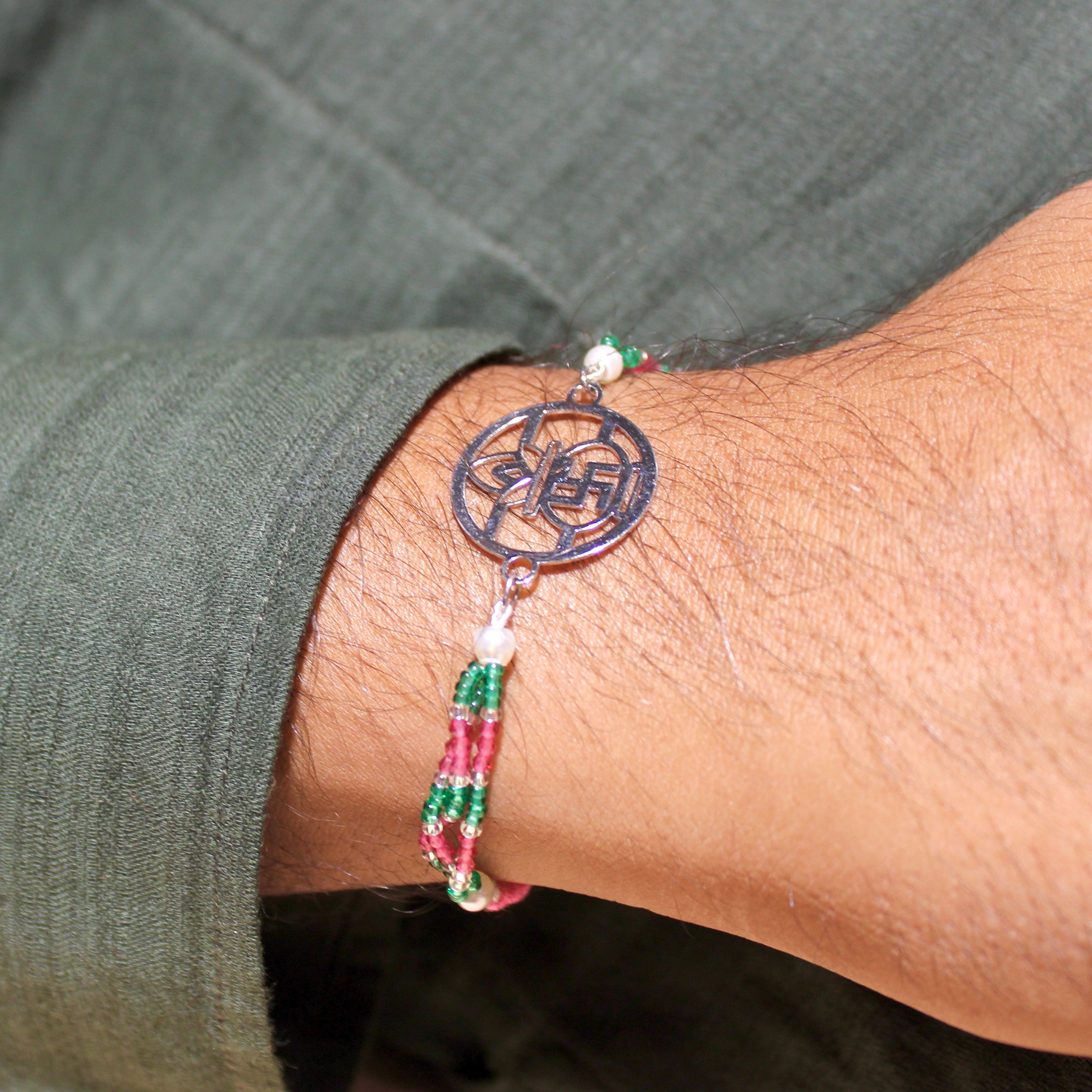 Satiya with kalash Pink Thread Rakhi in 925 Silver