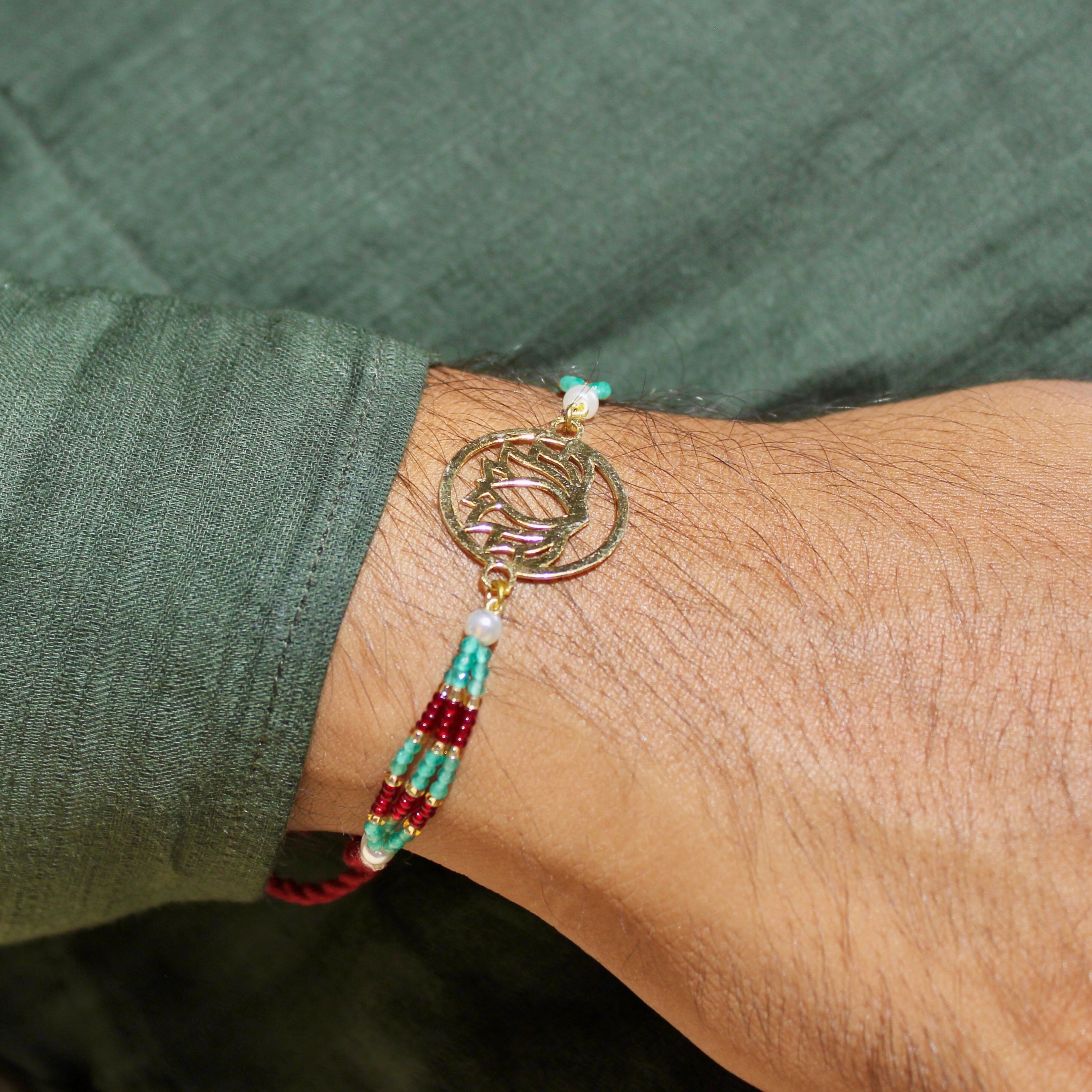 Lotus In Gold Polish Maroon Thread Rakhi In 925 Silver