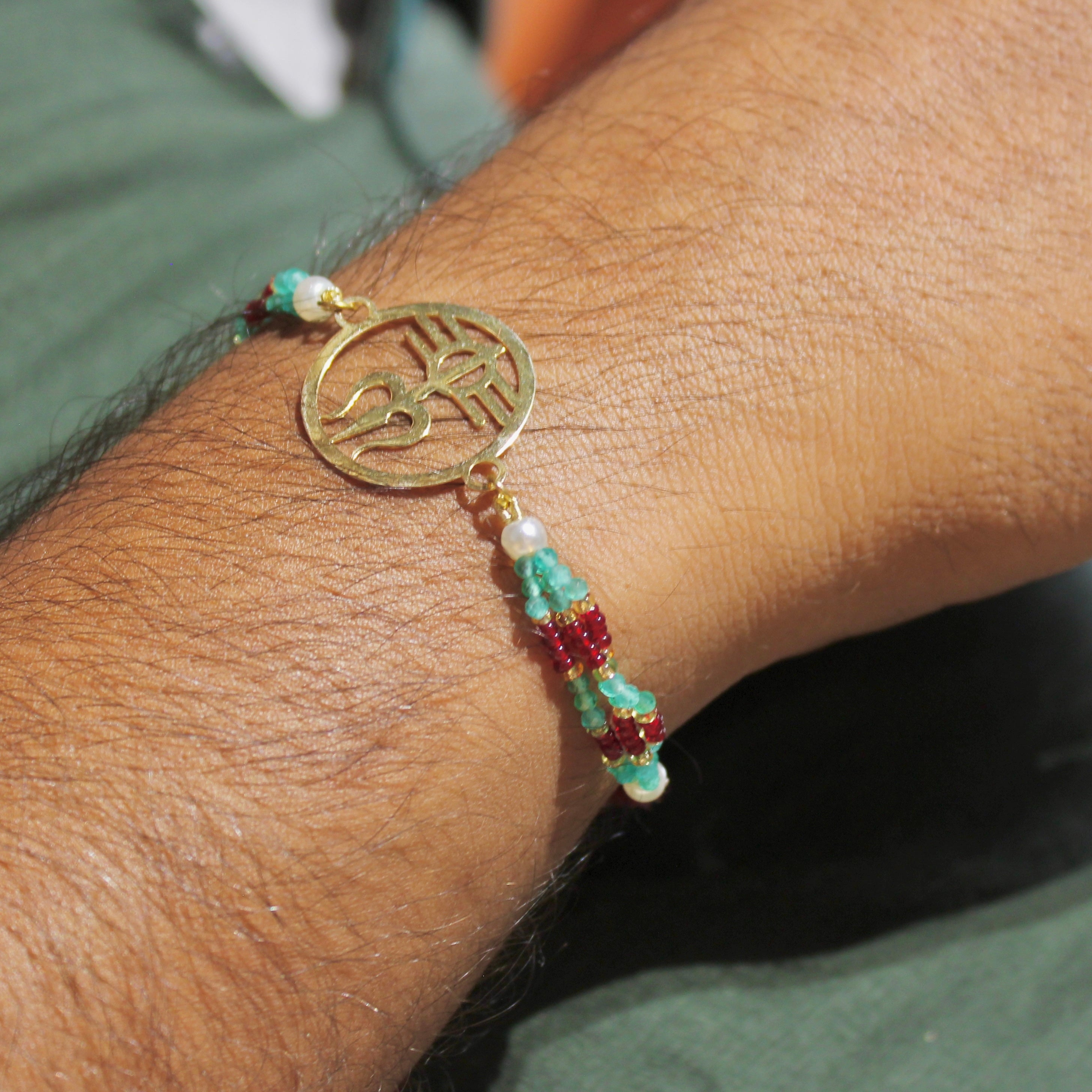 Trishul In Circle Gold Polish Maroon Thread Rakhi In 925 Silver