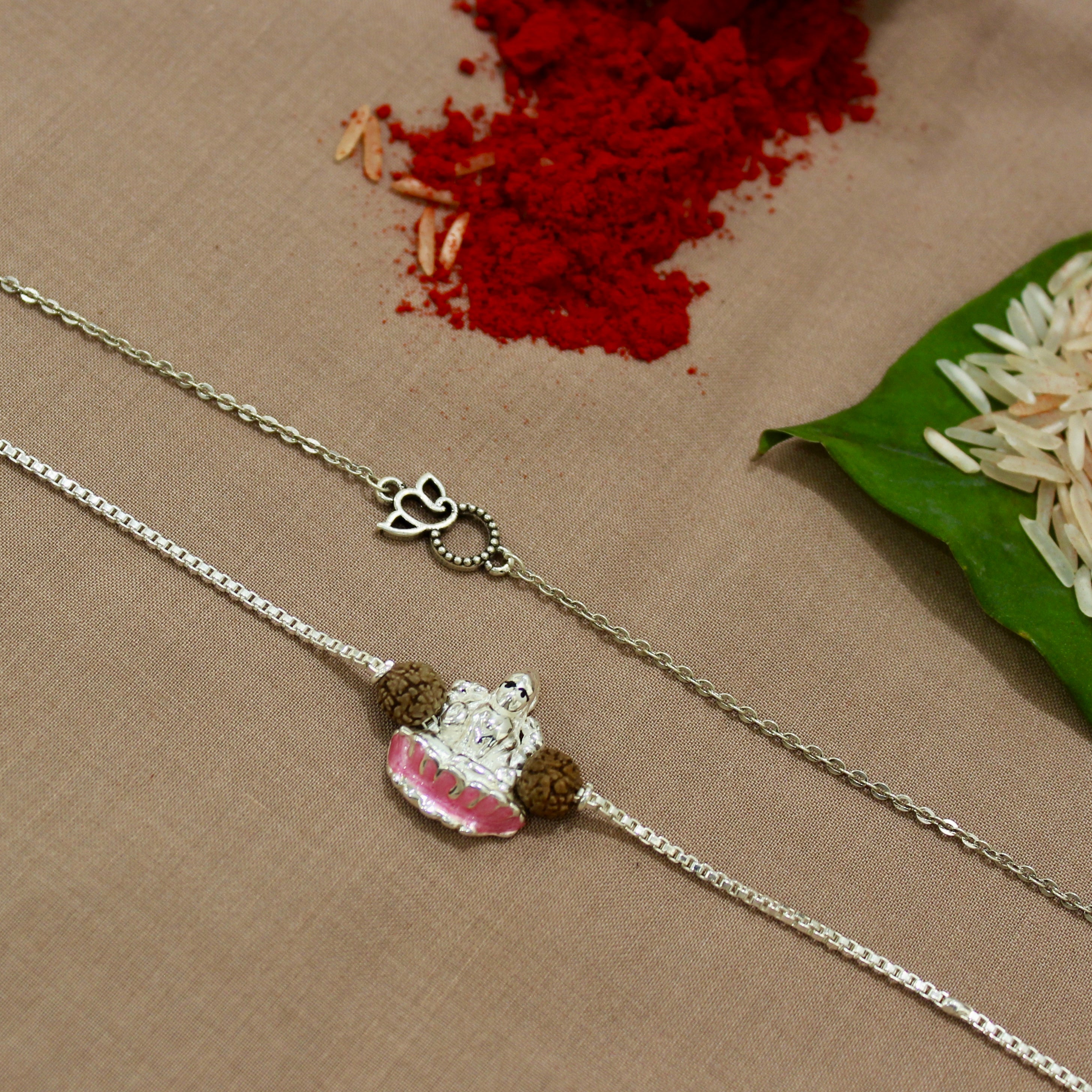 Ganesha Mini Charm and Laxmi ji Rudraksha Chained Rakhi in 925 Silver
