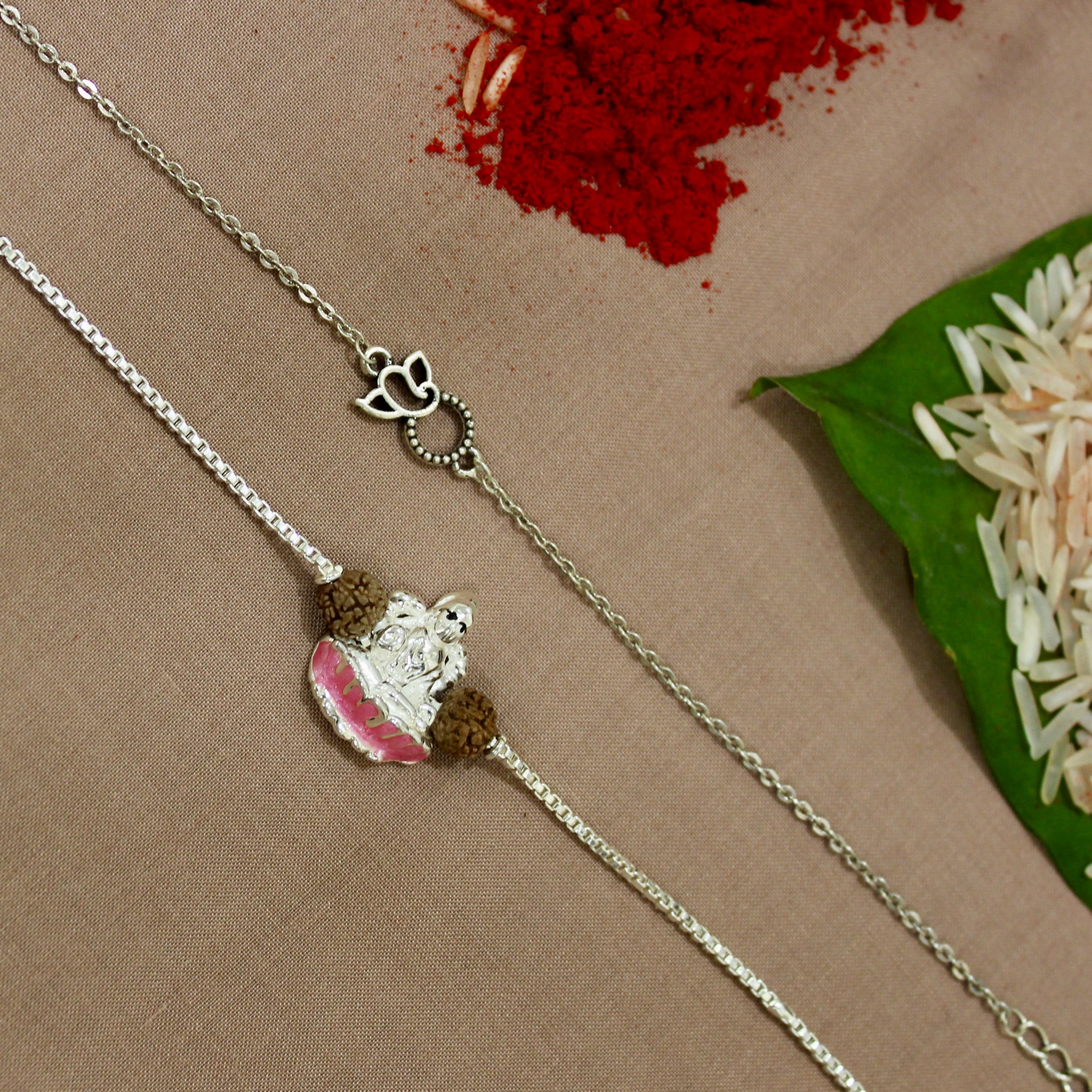 Ganesha Mini Charm and Laxmi ji Rudraksha Chained Rakhi in 925 Silver