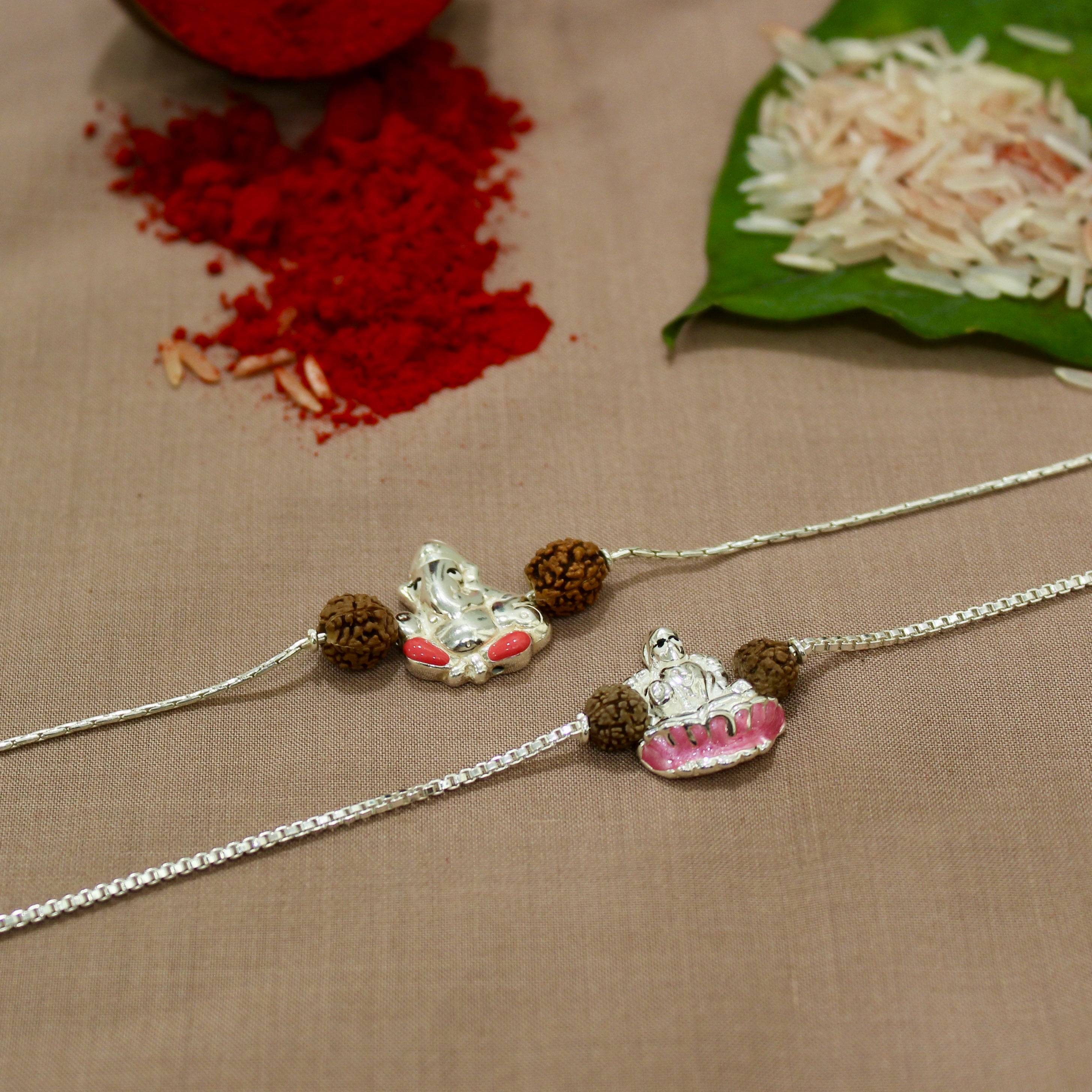 Lord Ganesh and Laxmi ji Rudraksha Chained Rakhi in 925 Silver