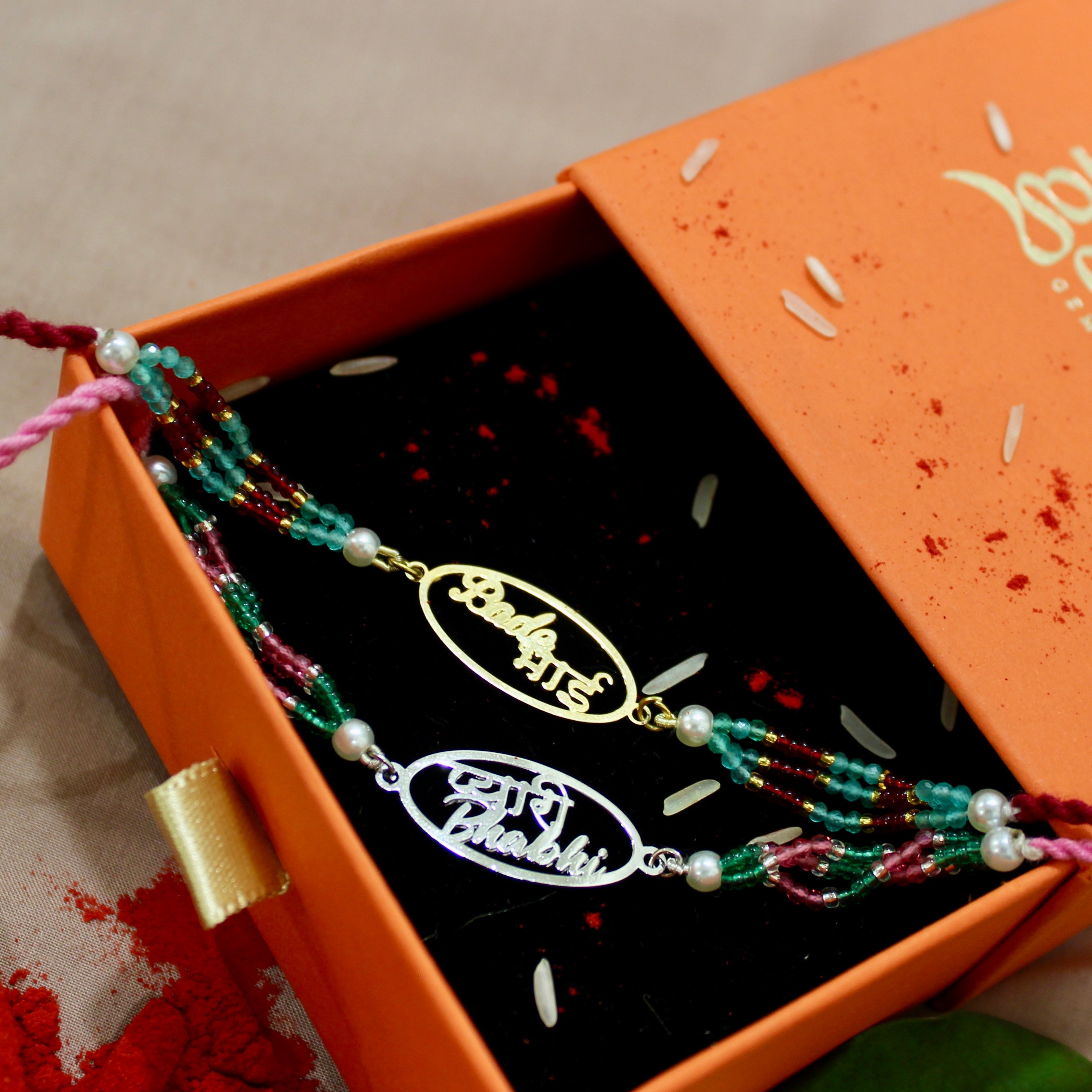 Bade Bhai in Circle Gold Polish Maroon Thread and Pyari Bhabhi Pink Thread Rakhi in 925 Silver
